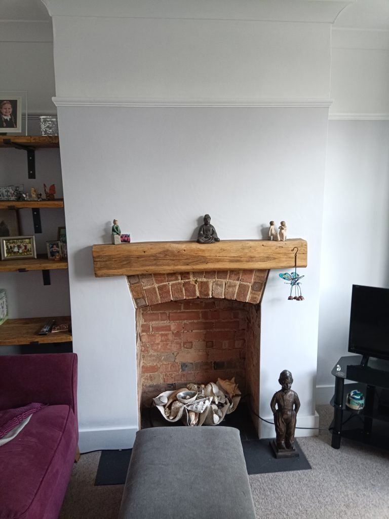 Oak mantel beam and alcove floating shelves fitted by TradesPro