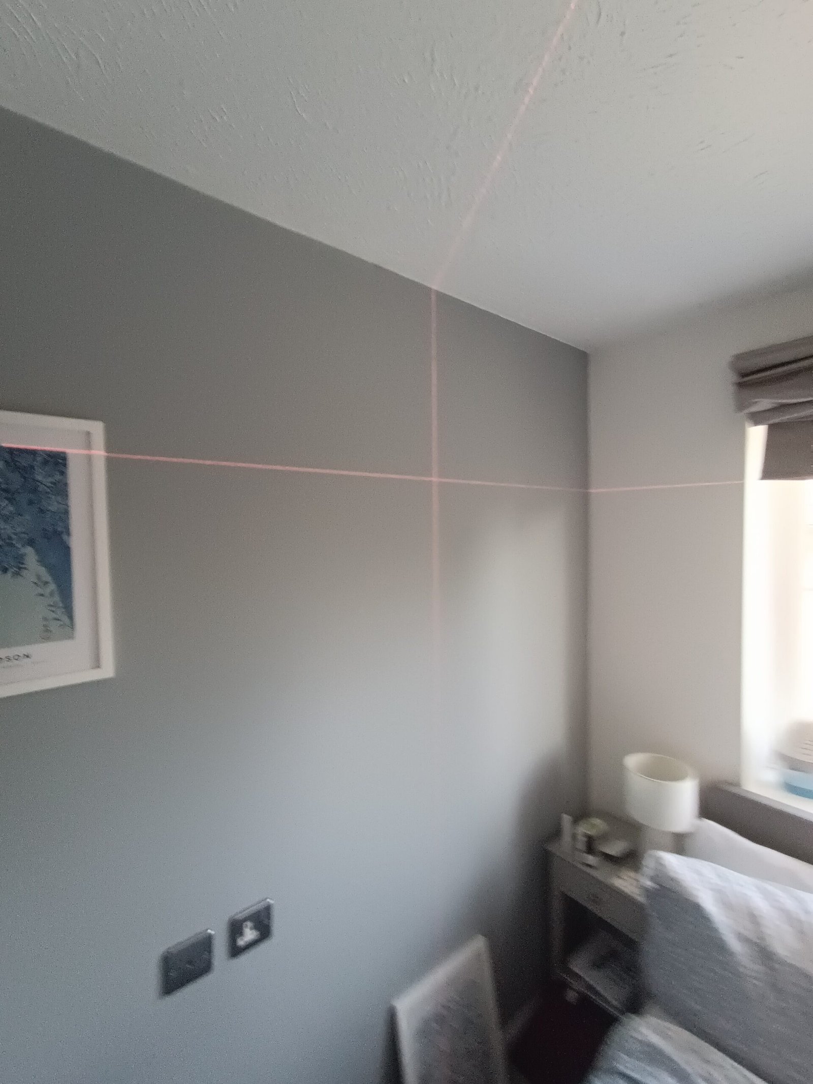 Picture hanging using laser level
