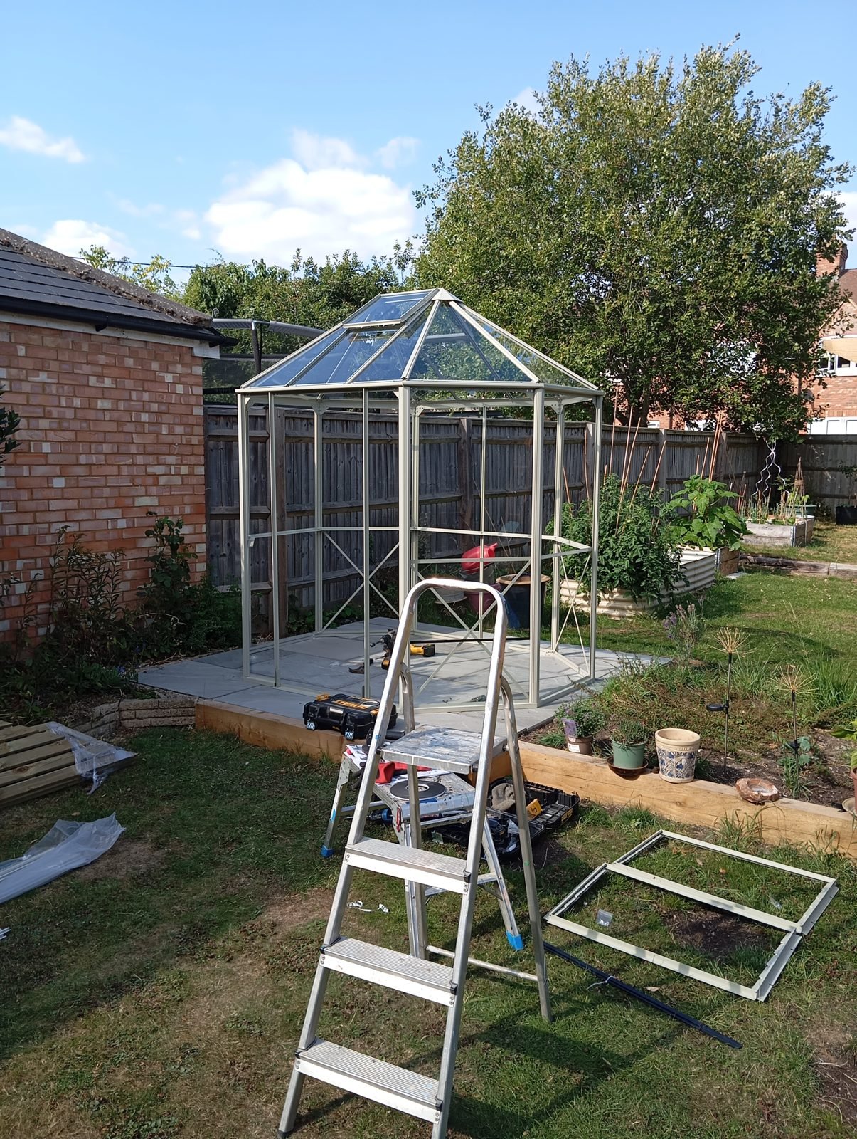Greenhouse with glass roof fitted and walls still open